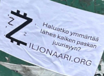 Mainostarra, jossa on Z-symboli dollariväkäsillä ja kampanjan tunnuslause.